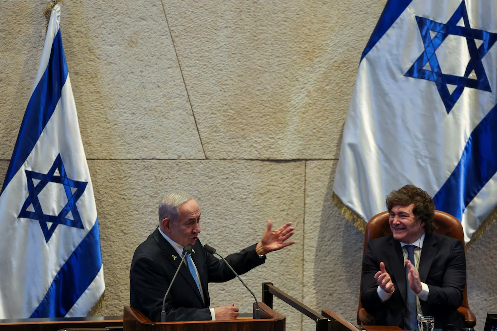 Argentine President Javier Milei applauds